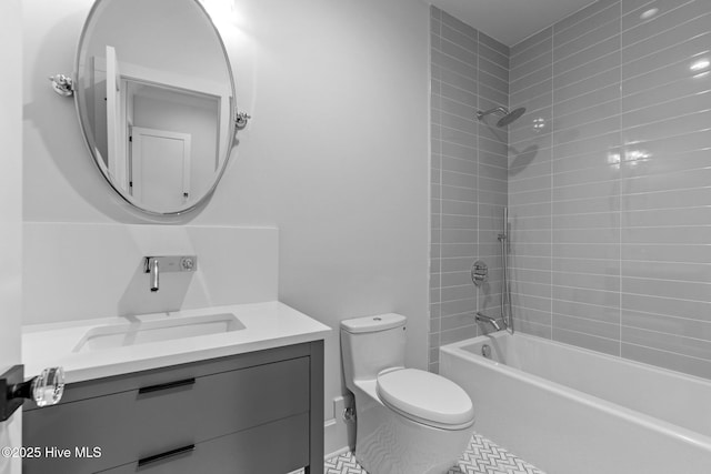 bathroom featuring vanity, tile patterned floors, toilet, and bathing tub / shower combination