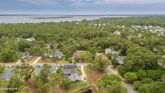 drone / aerial view with a water view and a residential view