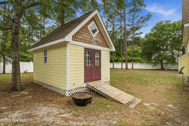 view of outbuilding with an outbuilding and fence
