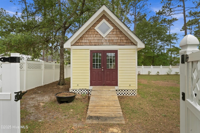 view of outbuilding with an outdoor structure and a fenced backyard