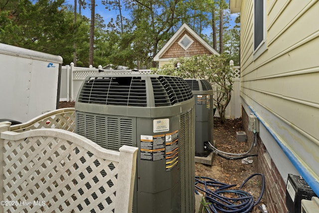 exterior details featuring fence and central AC