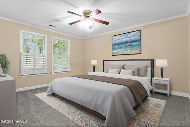 carpeted bedroom with visible vents, ceiling fan, crown molding, and baseboards