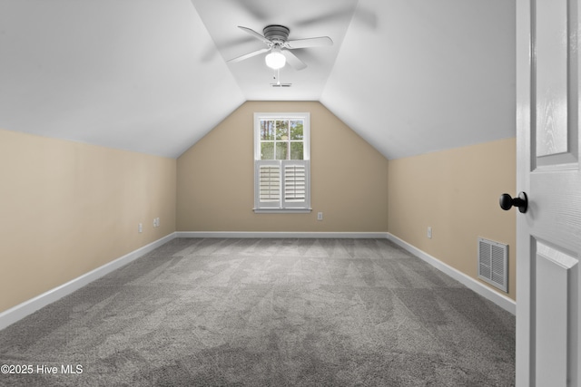 bonus room with carpet flooring, a ceiling fan, visible vents, and vaulted ceiling