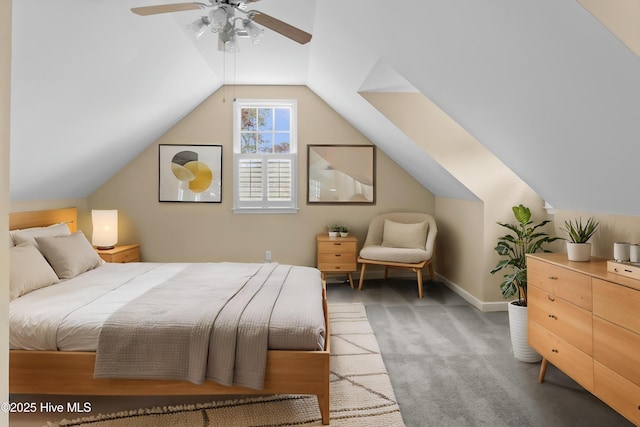 carpeted bedroom featuring baseboards, a ceiling fan, and vaulted ceiling