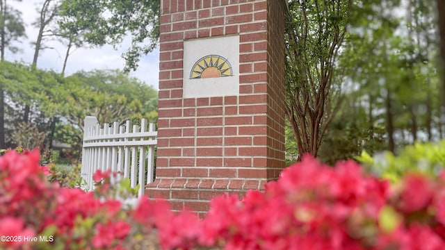 details with fence and brick siding