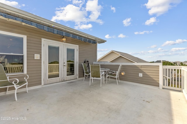 1605 Mackerel Ln Unit 2, Carolina Beach, NC 28428 - view of patio featuring french doors and outdoor dining area
