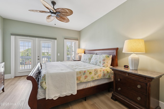 1605 Mackerel Ln Unit 2, Carolina Beach, NC 28428 - bedroom with access to outside, light wood-style floors, a ceiling fan, and baseboards