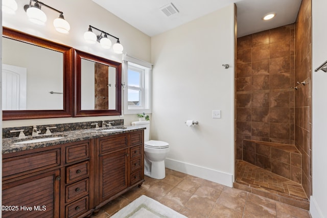 1605 Mackerel Ln Unit 2, Carolina Beach, NC 28428 - full bath with baseboards, double vanity, walk in shower, and toilet