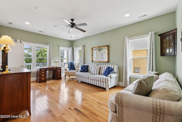 1605 Mackerel Ln Unit 2, Carolina Beach, NC 28428 - living area featuring light wood finished floors, ceiling fan, recessed lighting, and baseboards