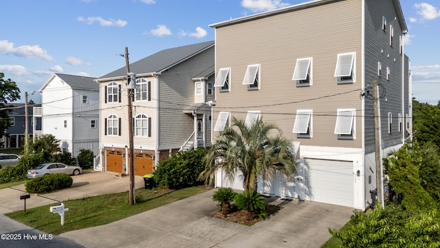 1605 Mackerel Ln Unit 2, Carolina Beach, NC 28428 - view of front of home featuring a garage and concrete driveway