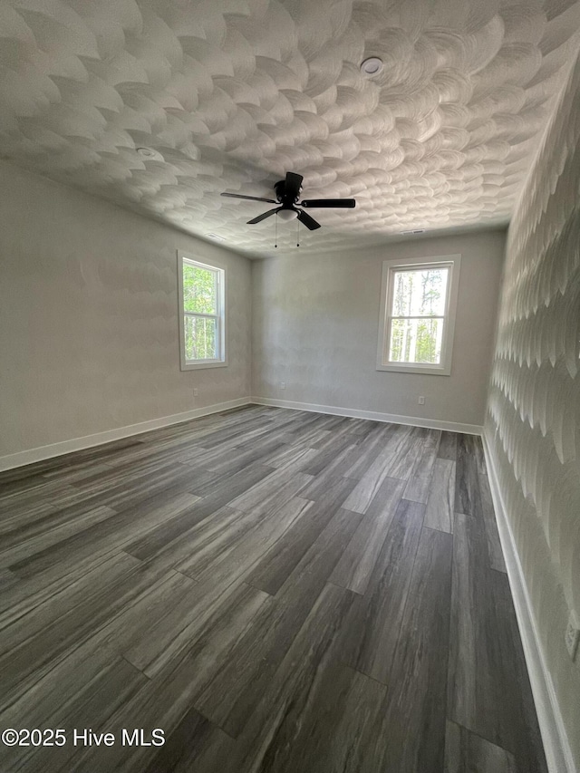 433 Riversound Dr, Edenton, NC 27932 - empty room featuring ceiling fan, baseboards, a healthy amount of sunlight, and dark wood-style floors