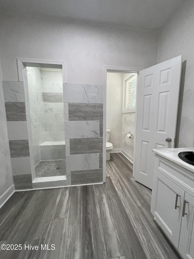 433 Riversound Dr, Edenton, NC 27932 - bathroom with wood finished floors, toilet, vanity, and a walk in shower