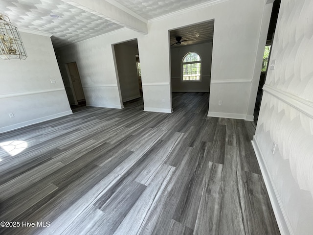 433 Riversound Dr, Edenton, NC 27932 - unfurnished living room featuring ceiling fan with notable chandelier, baseboards, dark wood-style floors, and ornamental molding