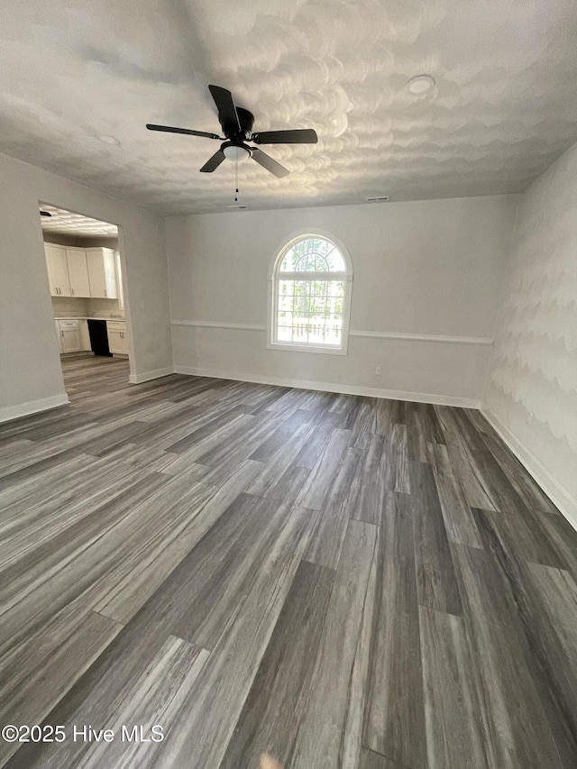 433 Riversound Dr, Edenton, NC 27932 - unfurnished living room with baseboards, a ceiling fan, and dark wood-style floors