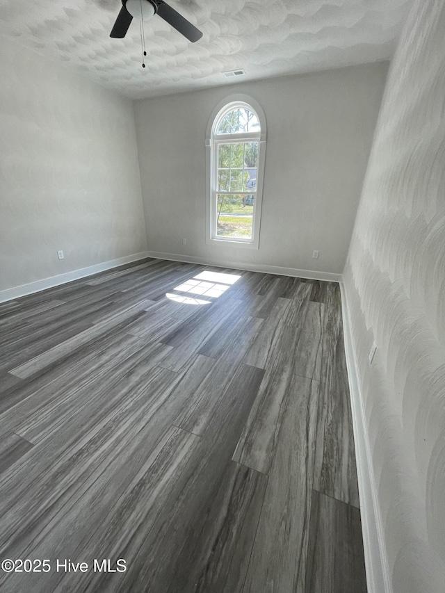 433 Riversound Dr, Edenton, NC 27932 - unfurnished room featuring visible vents, a ceiling fan, baseboards, and dark wood-style floors