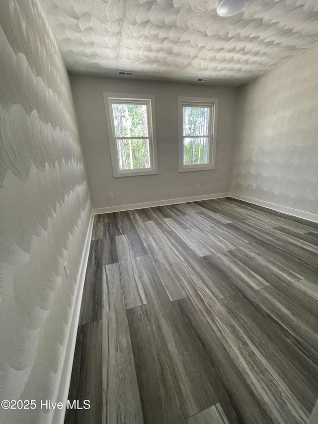 433 Riversound Dr, Edenton, NC 27932 - unfurnished room with visible vents, baseboards, and dark wood-type flooring