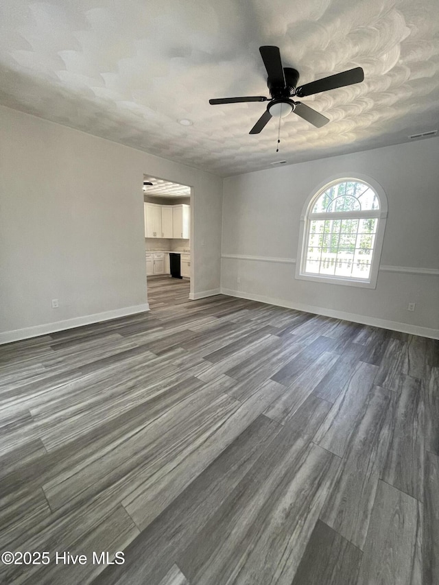 433 Riversound Dr, Edenton, NC 27932 - unfurnished living room featuring baseboards, a ceiling fan, and dark wood-type flooring