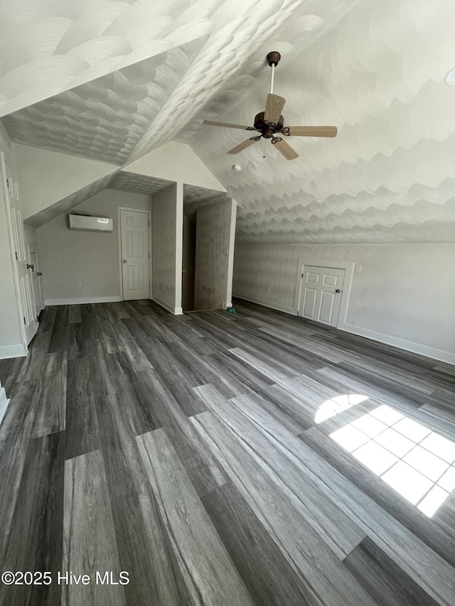 433 Riversound Dr, Edenton, NC 27932 - bonus room with a wall mounted air conditioner, lofted ceiling, dark wood-style floors, and baseboards