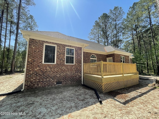 433 Riversound Dr, Edenton, NC 27932 - back of property with brick siding, roof with shingles, and a wooden deck