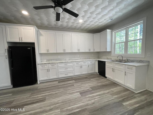 433 Riversound Dr, Edenton, NC 27932 - kitchen with recessed lighting, white cabinetry, a sink, black appliances, and ceiling fan