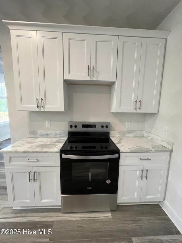 433 Riversound Dr, Edenton, NC 27932 - kitchen with wood finished floors, stainless steel range with electric stovetop, baseboards, and white cabinetry