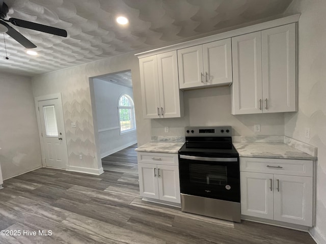 433 Riversound Dr, Edenton, NC 27932 - kitchen featuring dark wood-style flooring, stainless steel electric range, baseboards, white cabinetry, and a ceiling fan