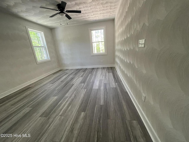 433 Riversound Dr, Edenton, NC 27932 - spare room with ceiling fan, baseboards, a healthy amount of sunlight, and dark wood-type flooring