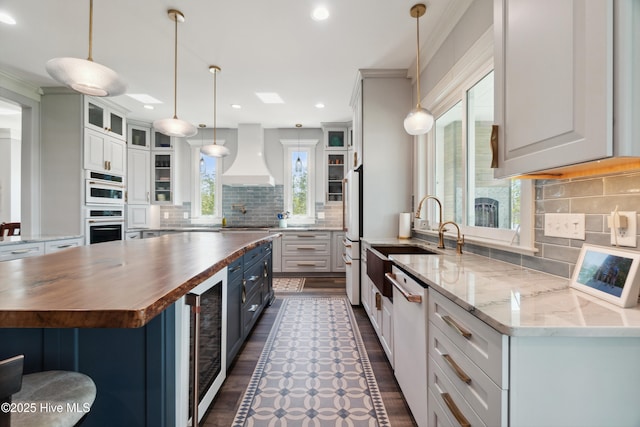 333 N Island Xing, Edenton, NC 27932 - kitchen featuring crown molding, custom exhaust hood, a sink, white appliances, and butcher block counters