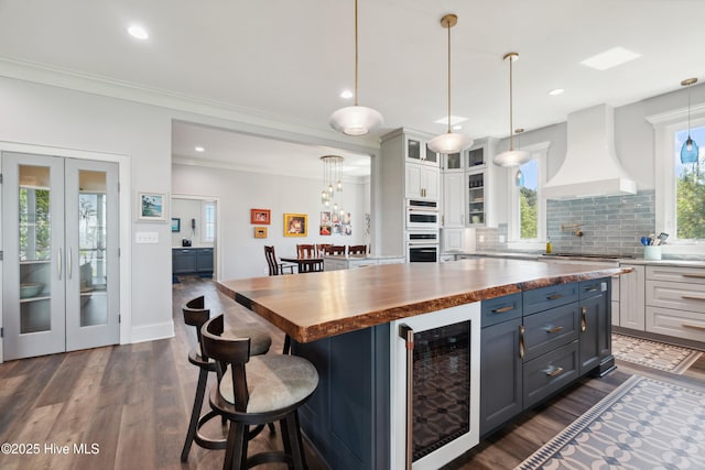 333 N Island Xing, Edenton, NC 27932 - kitchen featuring dark wood finished floors, wine cooler, premium range hood, butcher block counters, and white cabinetry