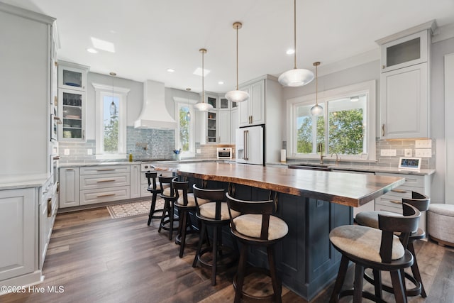 333 N Island Xing, Edenton, NC 27932 - kitchen with tasteful backsplash, custom exhaust hood, white appliances, butcher block counters, and dark wood-type flooring