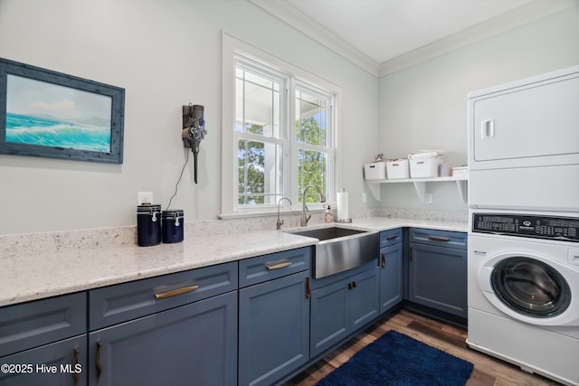 333 N Island Xing, Edenton, NC 27932 - laundry room featuring wood finished floors, a sink, stacked washer / dryer, cabinet space, and ornamental molding