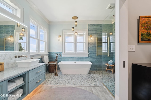 333 N Island Xing, Edenton, NC 27932 - full bath with tile walls, visible vents, a freestanding tub, crown molding, and vanity