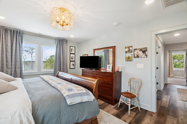 333 N Island Xing, Edenton, NC 27932 - bedroom with wood finished floors, an inviting chandelier, baseboards, visible vents, and recessed lighting