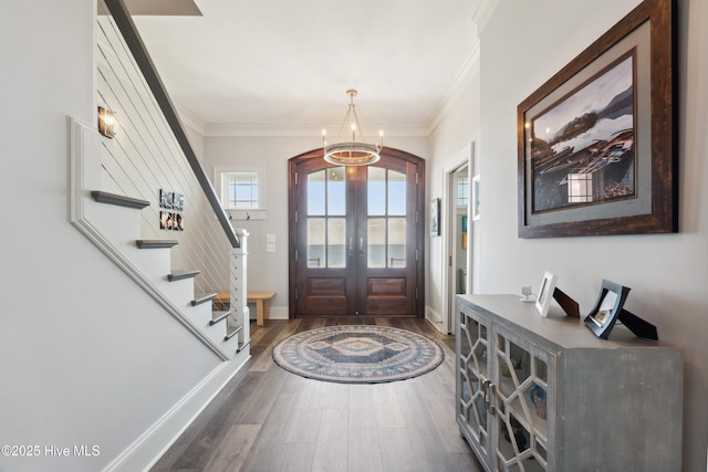 333 N Island Xing, Edenton, NC 27932 - foyer featuring french doors, arched walkways, dark wood-style flooring, an inviting chandelier, and ornamental molding
