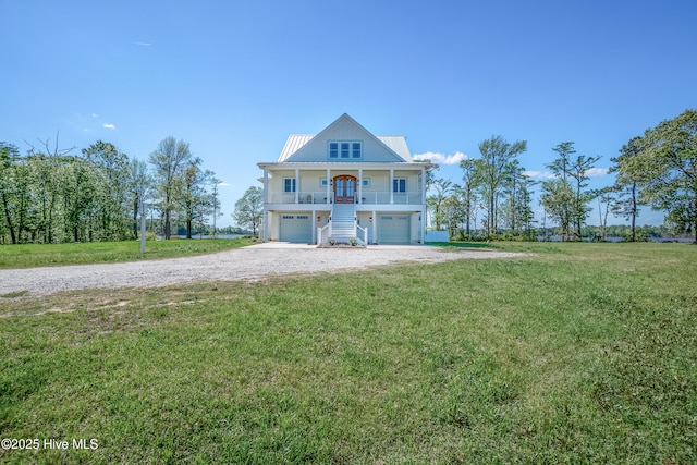 333 N Island Xing, Edenton, NC 27932 - view of front of home featuring an attached garage, stairway, a front yard, and covered porch