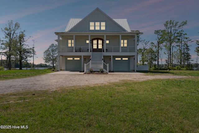 333 N Island Xing, Edenton, NC 27932 - coastal inspired home featuring covered porch, an attached garage, stairway, a yard, and dirt driveway