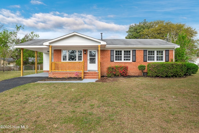 6203 Lynette Cir, Fayetteville, NC 28314 - ranch-style home with brick siding, asphalt driveway, and an attached carport