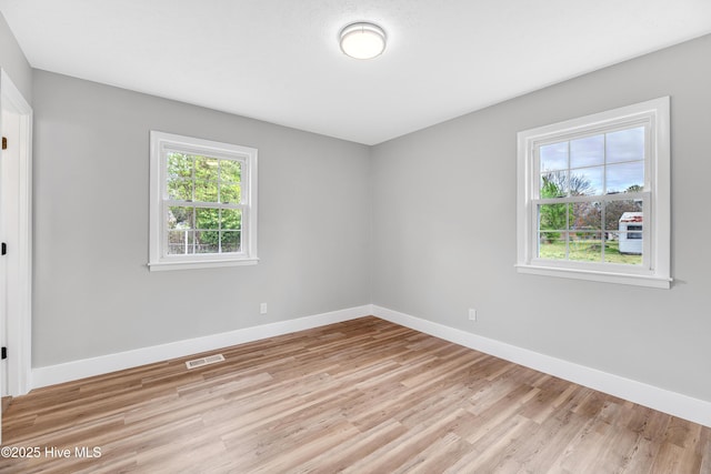 6203 Lynette Cir, Fayetteville, NC 28314 - empty room featuring plenty of natural light, light wood finished floors, and baseboards