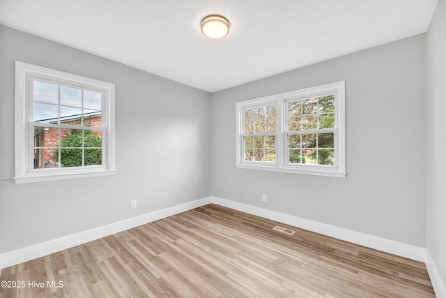 6203 Lynette Cir, Fayetteville, NC 28314 - spare room featuring plenty of natural light, baseboards, and light wood-type flooring