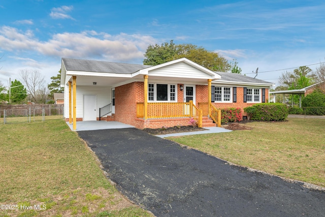 6203 Lynette Cir, Fayetteville, NC 28314 - ranch-style home with asphalt driveway, brick siding, a carport, and entry steps
