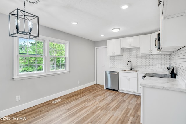6203 Lynette Cir, Fayetteville, NC 28314 - kitchen with appliances with stainless steel finishes, a sink, backsplash, baseboards, and recessed lighting