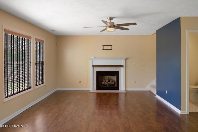 214 Target Ln, Hubert, NC 28539 - unfurnished living room with ceiling fan, wood finished floors, a fireplace with flush hearth, and baseboards