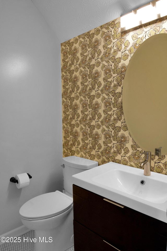 214 Target Ln, Hubert, NC 28539 - half bathroom featuring wallpapered walls, vanity, and toilet