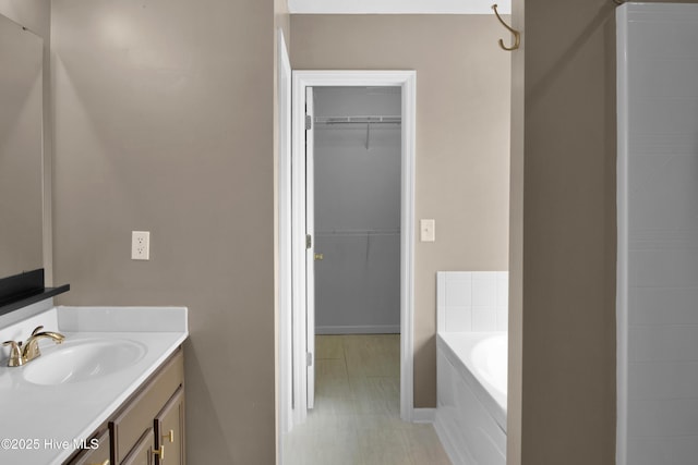 214 Target Ln, Hubert, NC 28539 - bathroom featuring vanity, a garden tub, a walk in closet, and tile patterned flooring