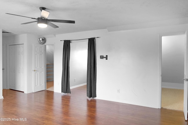 214 Target Ln, Hubert, NC 28539 - unfurnished bedroom featuring wood finished floors, baseboards, and a ceiling fan