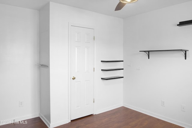 214 Target Ln, Hubert, NC 28539 - unfurnished bedroom with dark wood-style flooring, baseboards, and a ceiling fan