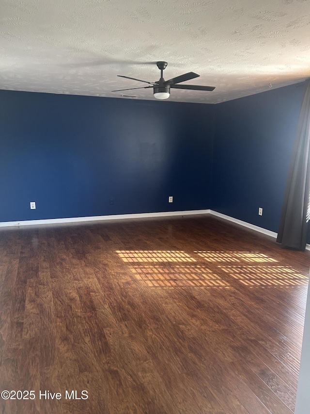 214 Target Ln, Hubert, NC 28539 - unfurnished room featuring wood finished floors, a textured ceiling, baseboards, and ceiling fan