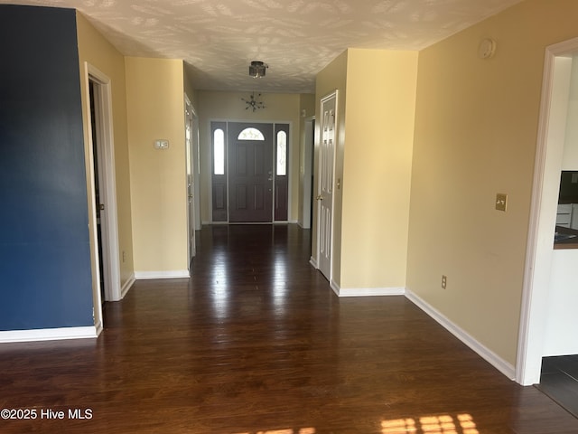 214 Target Ln, Hubert, NC 28539 - foyer with dark wood-style flooring and baseboards