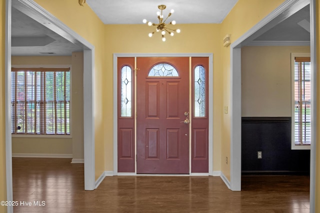 214 Target Ln, Hubert, NC 28539 - foyer entrance with wood finished floors, a chandelier, healthy amount of natural light, and baseboards