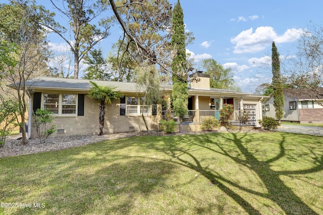 2409 Westminister Way, Wilmington, NC 28405 - single story home featuring crawl space, a garage, covered porch, and a front lawn